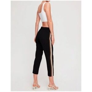 Babaton Black Cropped Track Pants with Gold & Cream Side Stripes